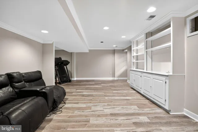 a view of a house with wooden floor next to a yard