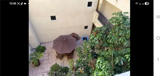 a view of entryway with flower plants