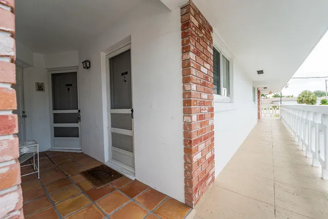 a view of balcony with furniture