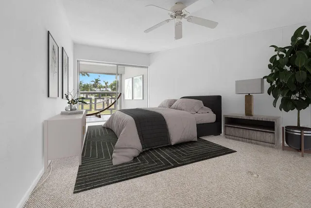 a bathroom with a shower a toilet and a sink