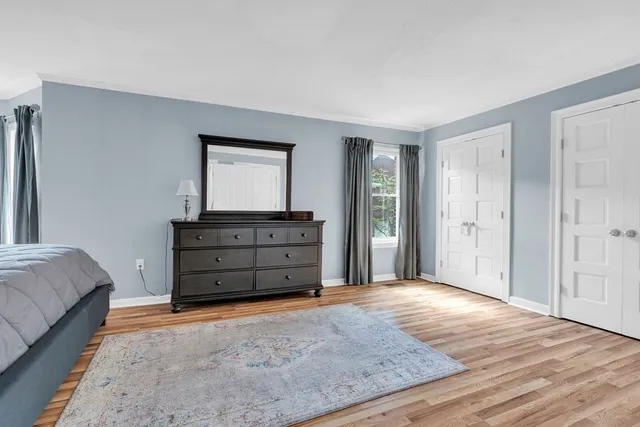 a room with a dresser and a mirror