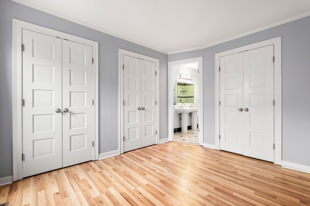 166 Quincy Shore Drive, Unit 108 Quincy, MA 02171 - Photo 17 of 36 a view of a livingroom with wooden floor