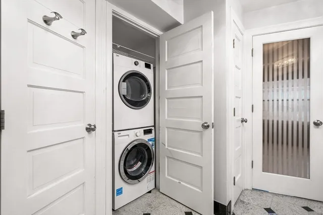 a view of a hallway with washer and dryer