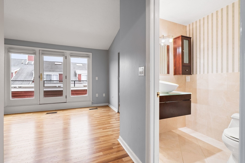166 Quincy Shore Drive, Unit 108 Quincy, MA 02171 - Photo 25 of 36 a view of livingroom with furniture and wooden floor