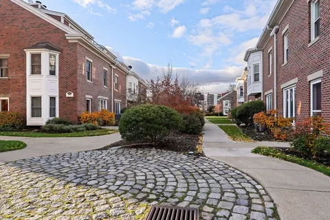 a view of a pathway both side of house