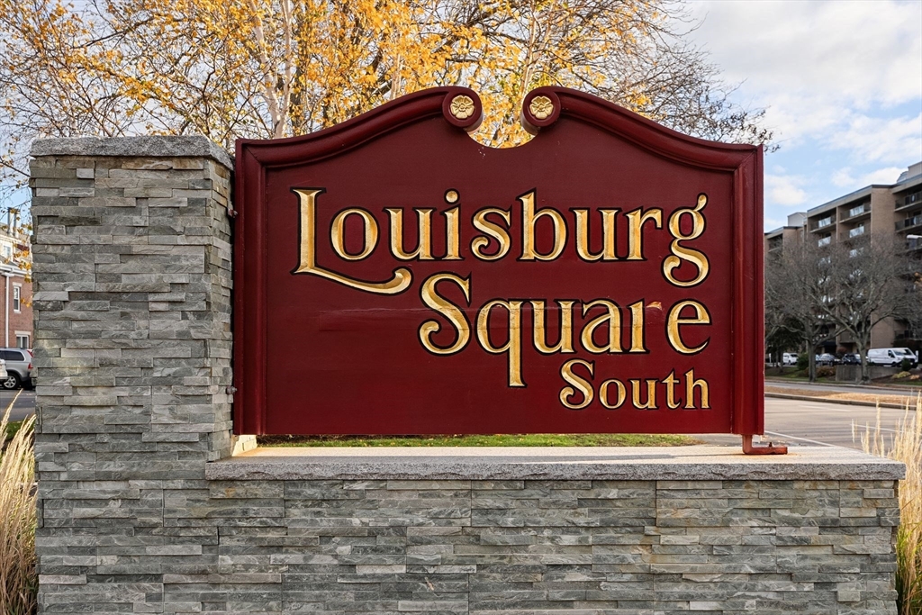 166 Quincy Shore Drive, Unit 108 Quincy, MA 02171 - Photo 35 of 36 a sign that is on a brick wall