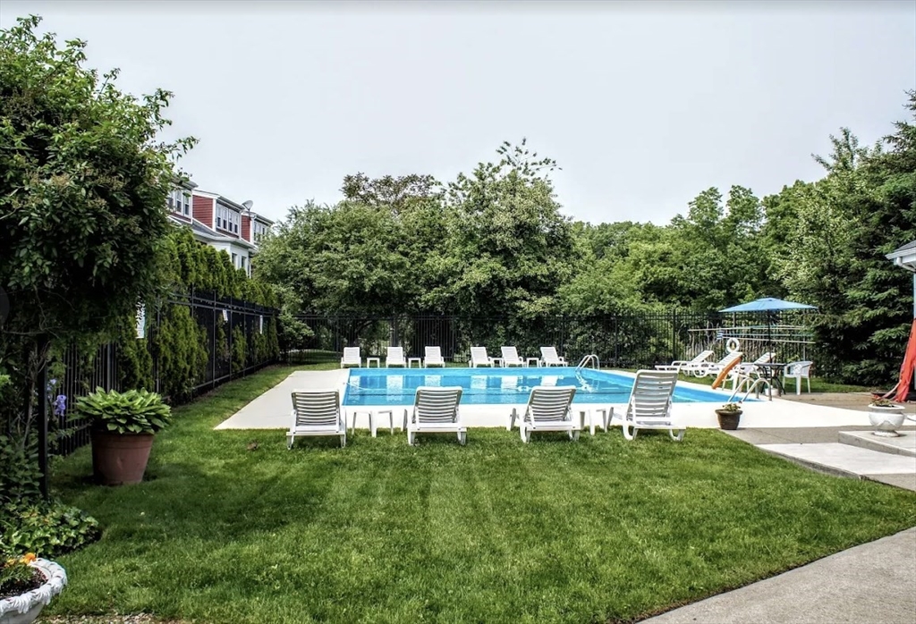 166 Quincy Shore Drive, Unit 108 Quincy, MA 02171 - Photo 36 of 36 a view of a chair and table in the garden