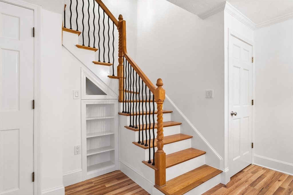166 Quincy Shore Drive, Unit 108 Quincy, MA 02171 - Photo 10 of 36 a view of entryway and hall with wooden floor