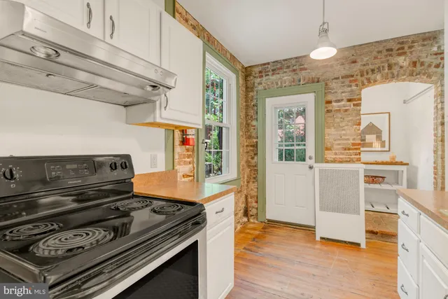 a kitchen with a stove and a microwave