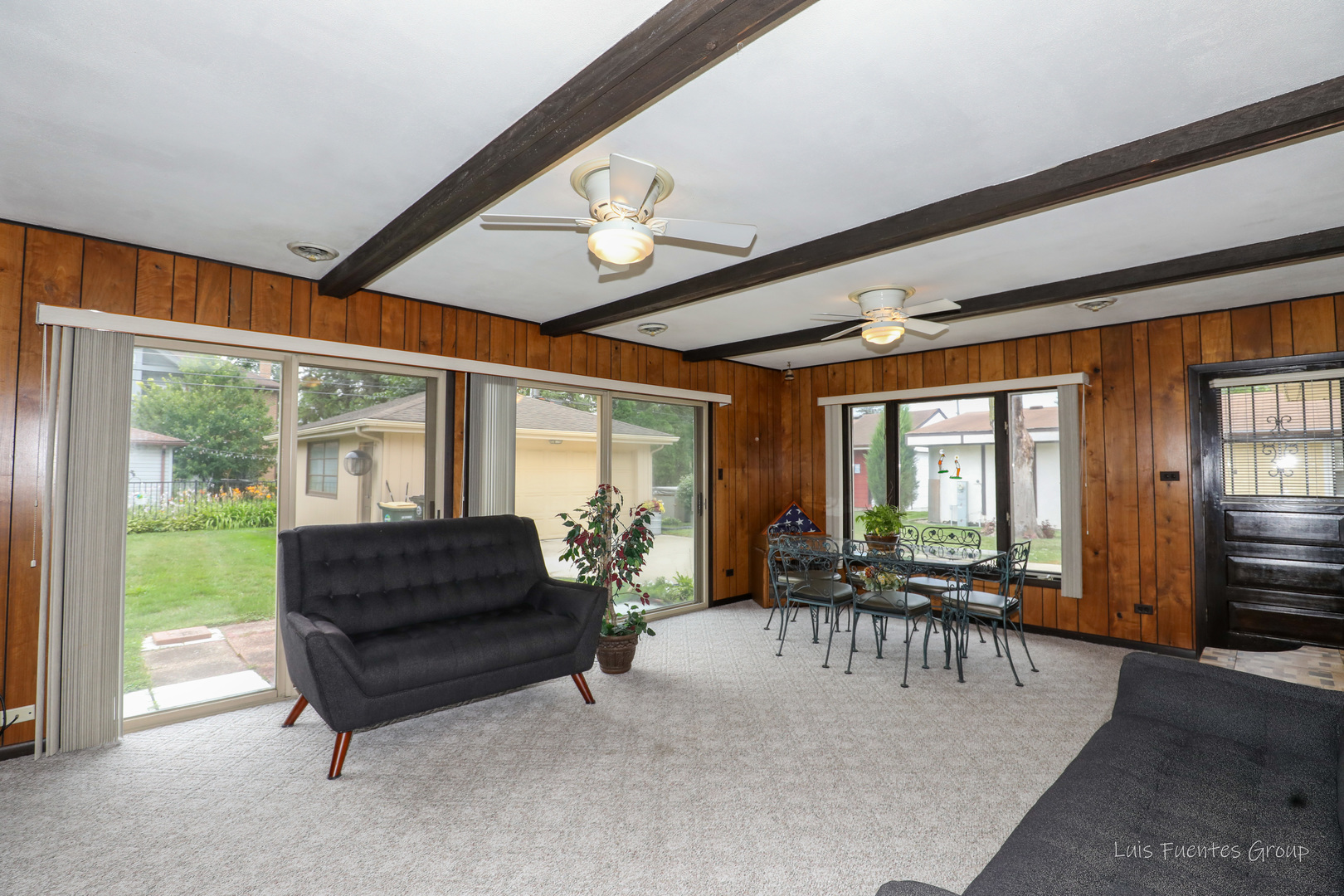 623 Wesley Drive Park Ridge, IL 60068 - Photo 13 of 23 a living room with furniture a ceiling fan and a large window