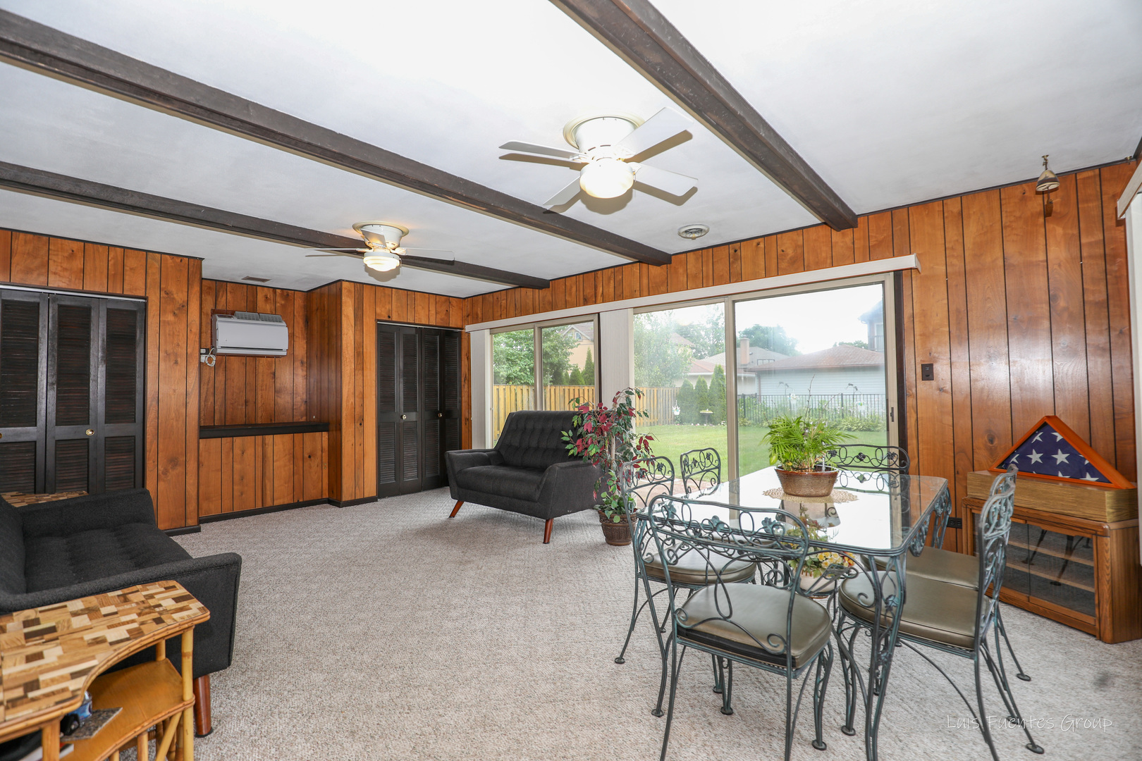 623 Wesley Drive Park Ridge, IL 60068 - Photo 3 of 23 a living room with furniture a ceiling fan and a large window