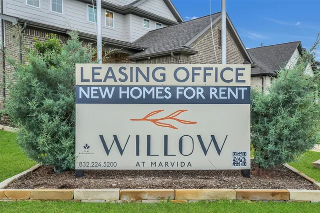 an aerial view of a house with a swimming pool