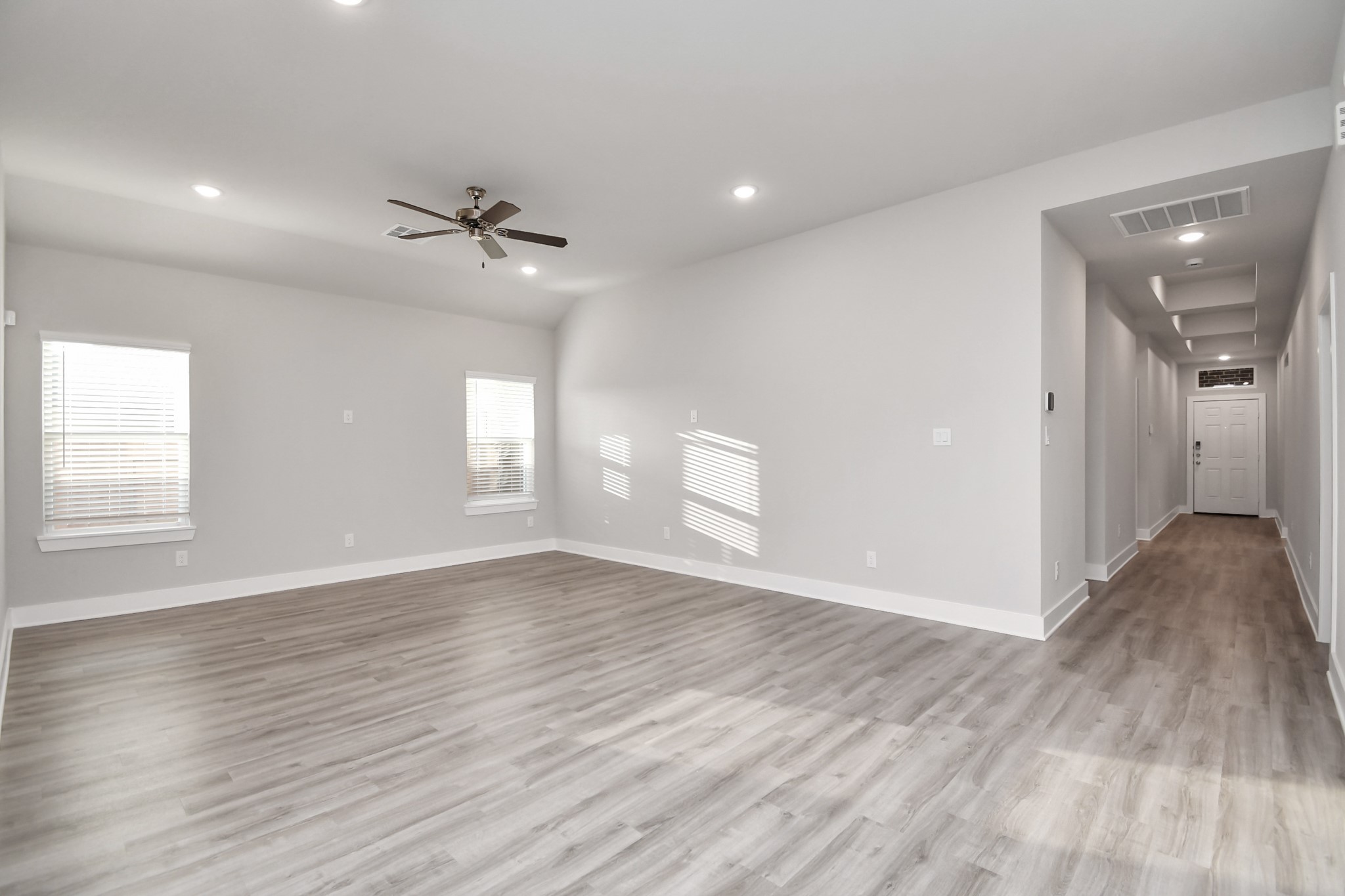 7510 Terramar Bay Lane Cypress, TX 77433 - Photo 3 of 20 an empty room with wooden floor and windows