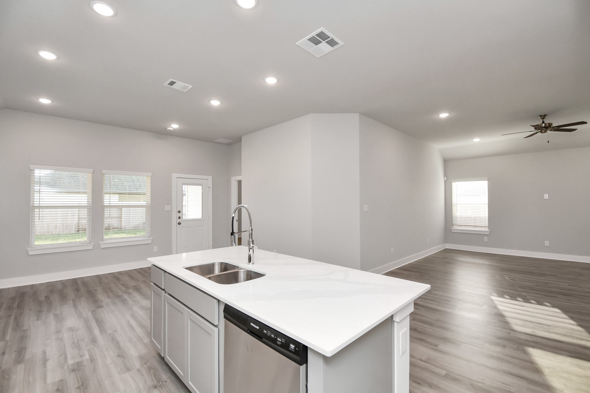 7510 Terramar Bay Lane Cypress, TX 77433 - Photo 20 of 20 a kitchen with a sink windows and wooden floor