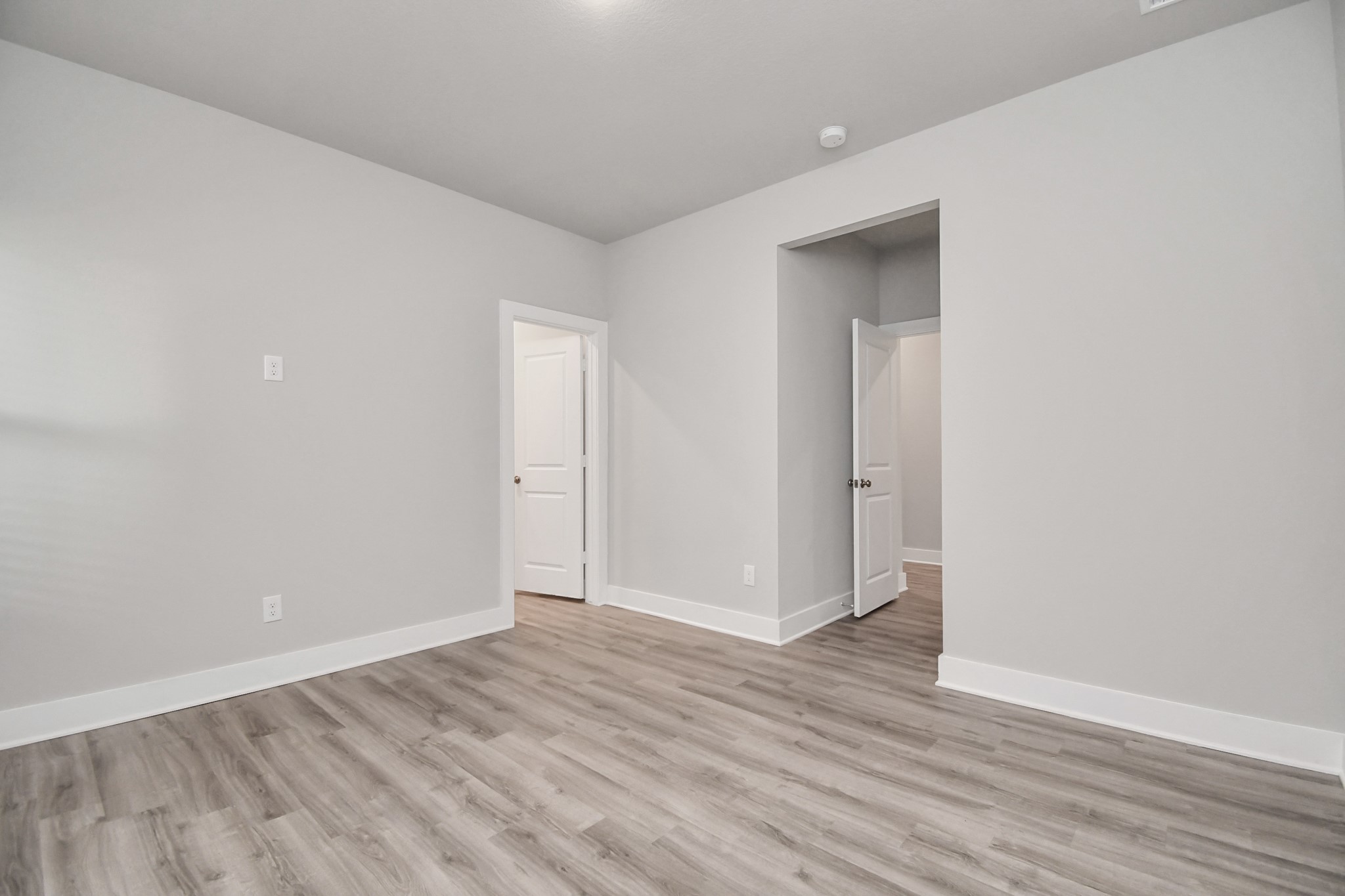 7510 Terramar Bay Lane Cypress, TX 77433 - Photo 7 of 20 a view of an empty room with wooden floor and closet