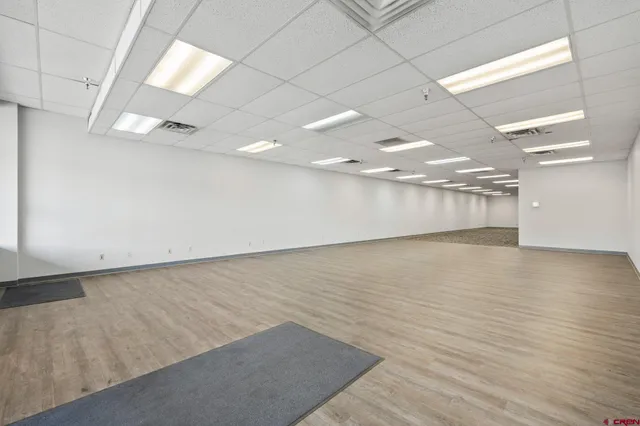 an empty room with wooden floor