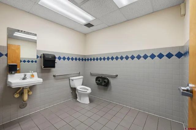 a room with gym equipment and white walls