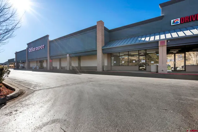 a view of a street with cars