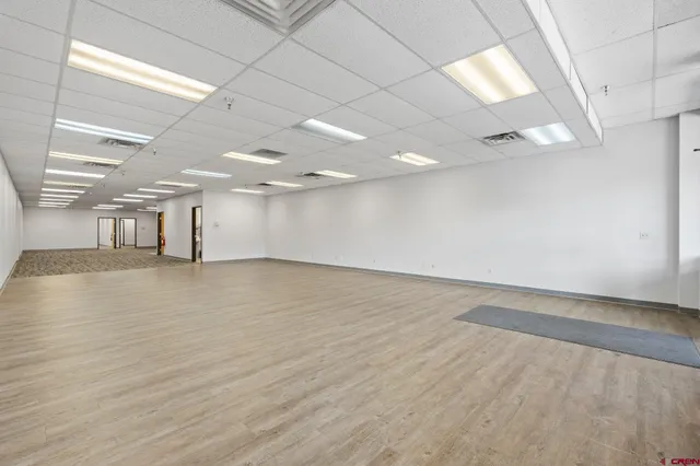 an empty room with wooden floor