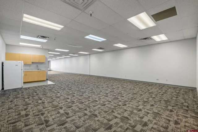 an empty room with wooden floor