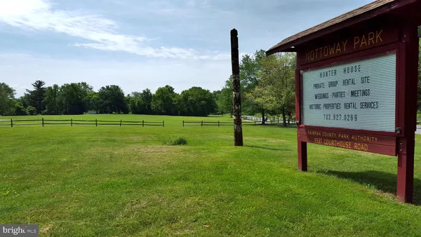 a view of a swimming pool with a slide in the patio