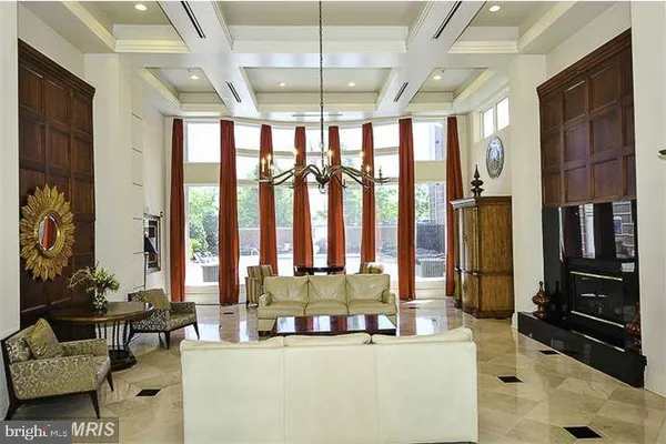 a kitchen with a stove a sink a refrigerator and cabinets