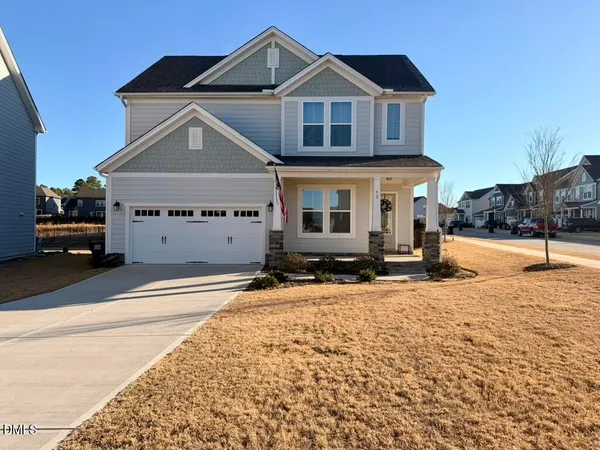 a front view of a house with yard