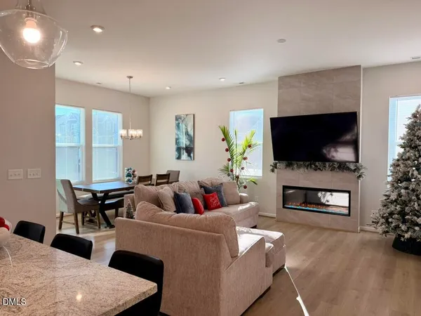 a kitchen with stainless steel appliances granite countertop a stove refrigerator and microwave