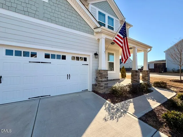 a front view of a house with barbeque area