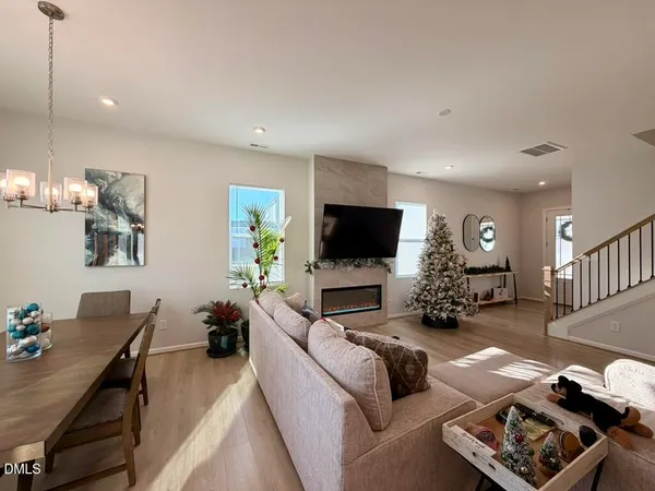 a living room with a flat screen tv and a fireplace