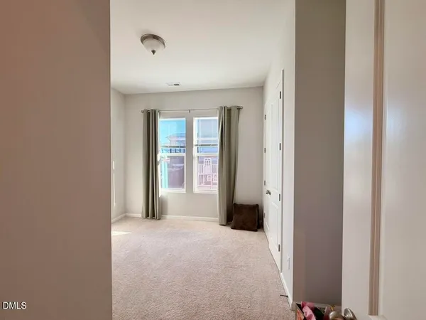 a view of a hallway with front door