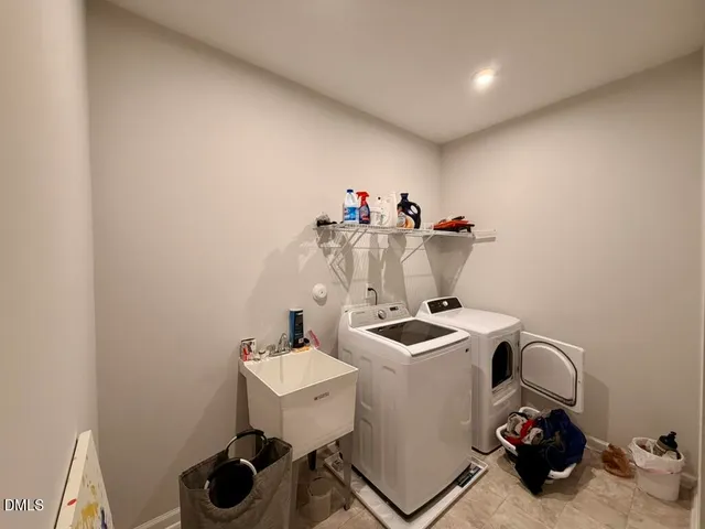 a bedroom with a bed and a large mirror