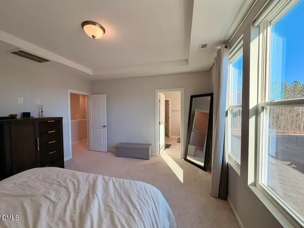 a bathroom with a shower sink and mirror