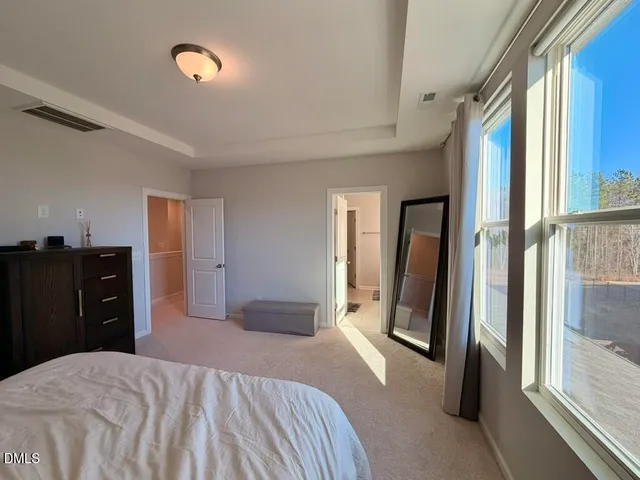 a bathroom with a shower sink and mirror