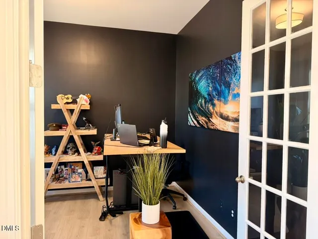a living room with furniture and a christmas tree