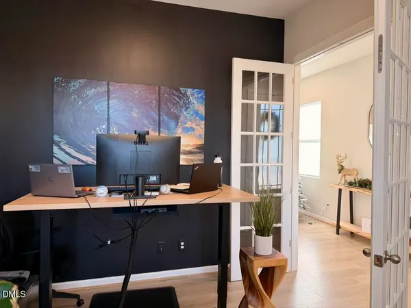 a living room with kitchen island furniture and a large window