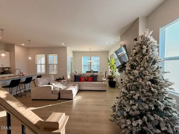 a living room with fireplace furniture and a flat screen tv