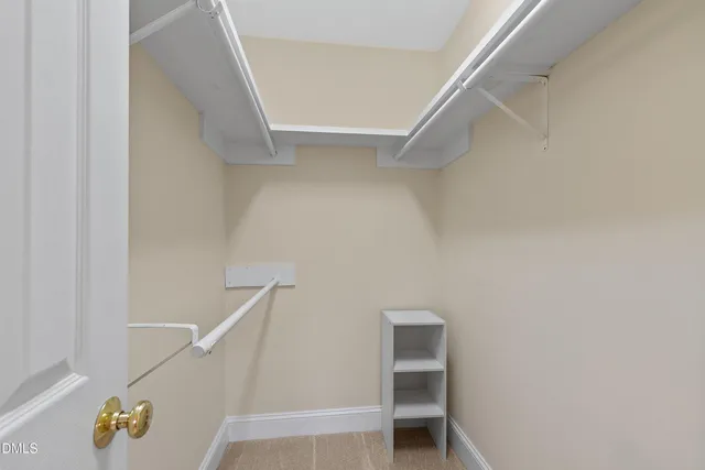 a bathroom with a toilet and a shower curtain