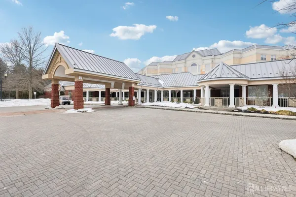 a front view of a building with a street view