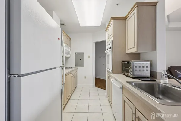a kitchen with a refrigerator sink and stove