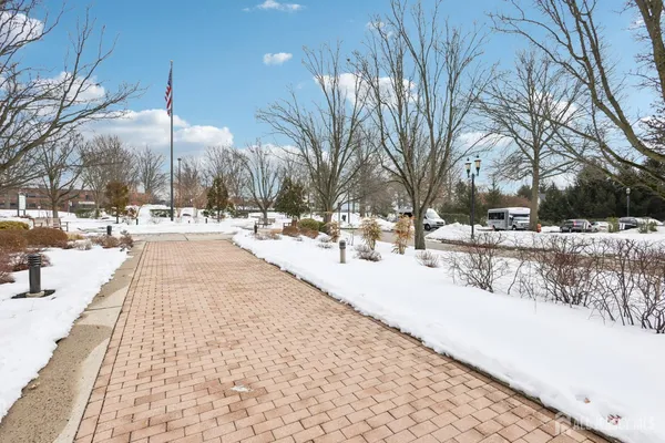 a view of pathway with a yard