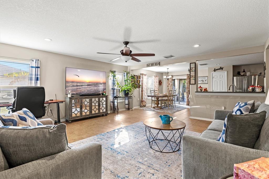 5213 Moon Shell Drive Apollo Beach, FL 33572 - Photo 13 of 69 a living room with furniture and a flat screen tv