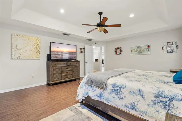 a bathroom with a granite countertop toilet a sink and a mirror