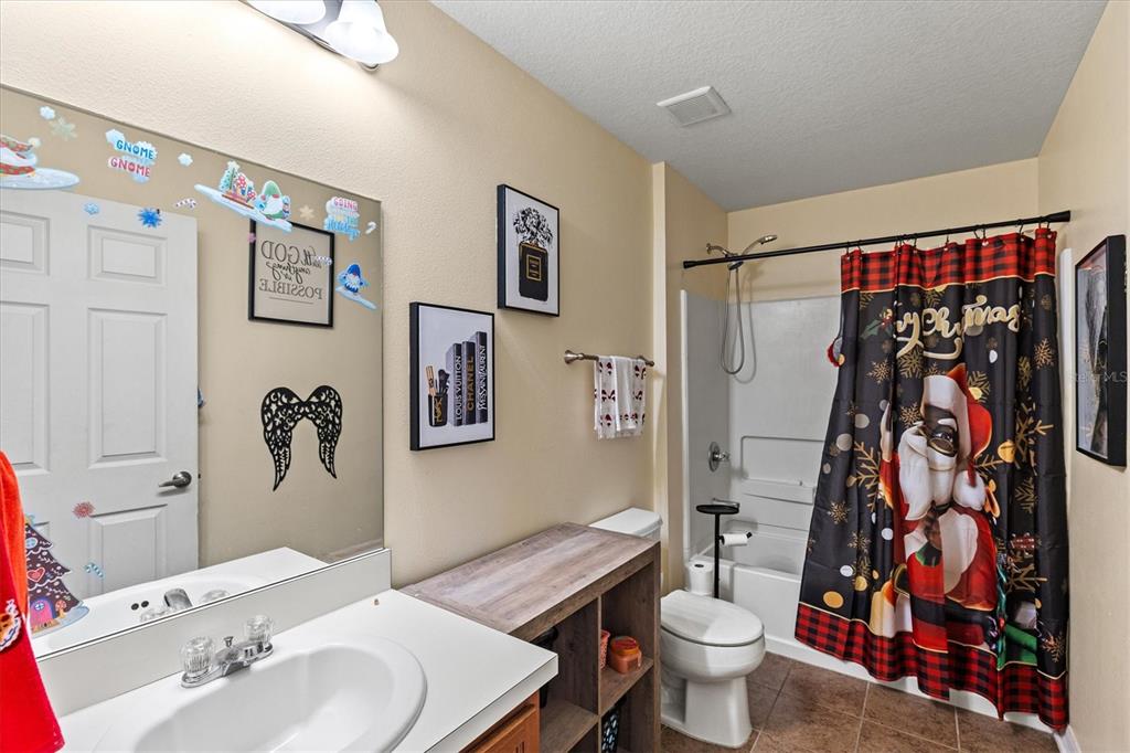 5213 Moon Shell Drive Apollo Beach, FL 33572 - Photo 24 of 69 a bathroom with a sink toilet and shower