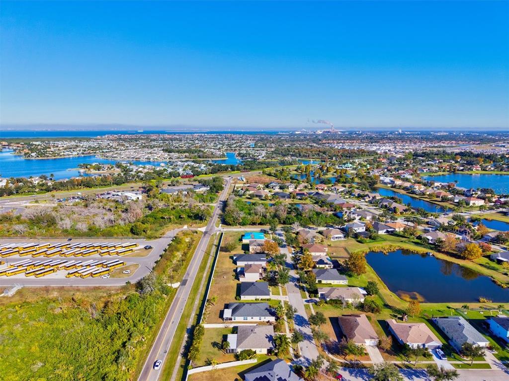 5213 Moon Shell Drive Apollo Beach, FL 33572 - Photo 38 of 69 an aerial view of residential building and lake