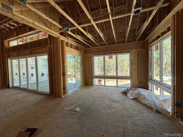 a view of an empty room with a balcony