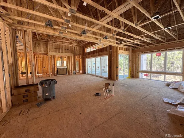a view of an empty room with windows