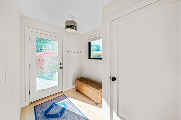 a bathroom with a tub and window