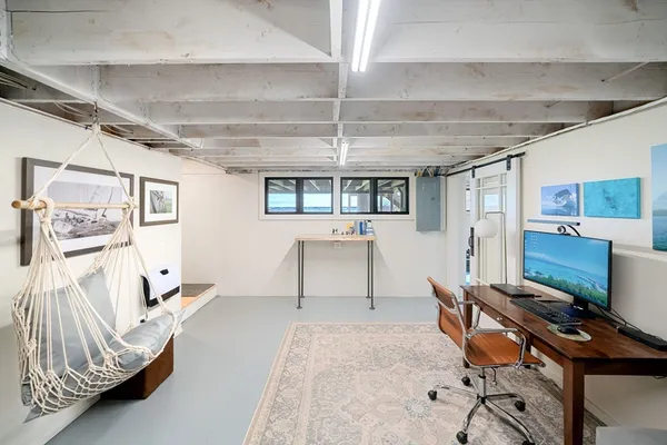 a workspace with furniture and window