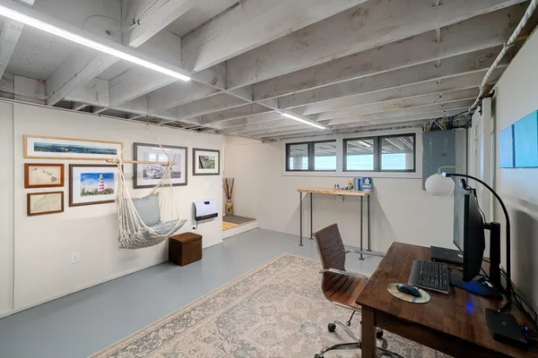 a workspace with furniture hardwood and a window